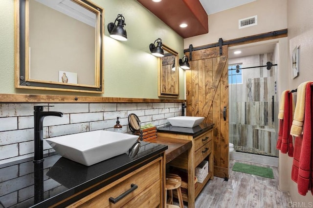 7661 Sitio Algodon, Carlsbad, CA 92009 - bathroom with a stall shower, vanity, wood finished floors, and recessed lighting
