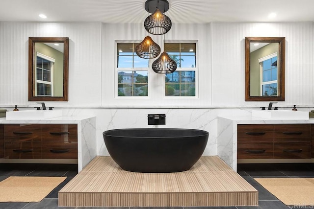 7661 Sitio Algodon, Carlsbad, CA 92009 - full bathroom with two vanities, tile patterned floors, and a freestanding bath