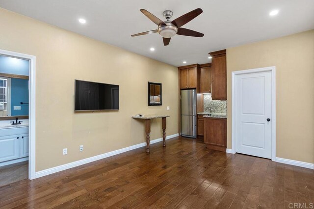 7661 Sitio Algodon, Carlsbad, CA 92009 - kitchen with freestanding refrigerator, ceiling fan, dark wood-style flooring, backsplash, and recessed lighting