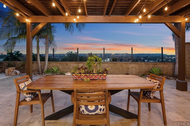 7661 Sitio Algodon, Carlsbad, CA 92009 - patio terrace at dusk with outdoor dining space and a patio area