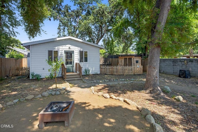 310 N Fulton St, Ojai, CA 93023 - bungalow featuring a fire pit, a fenced backyard, and an outdoor structure