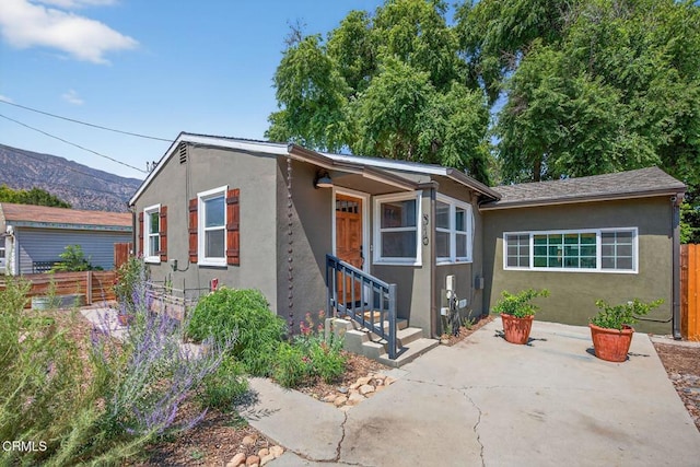 310 N Fulton St, Ojai, CA 93023 - view of front of home featuring stucco siding, a patio, and a mountain view