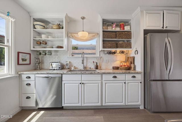 310 N Fulton St, Ojai, CA 93023 - kitchen with appliances with stainless steel finishes, open shelves, and decorative backsplash