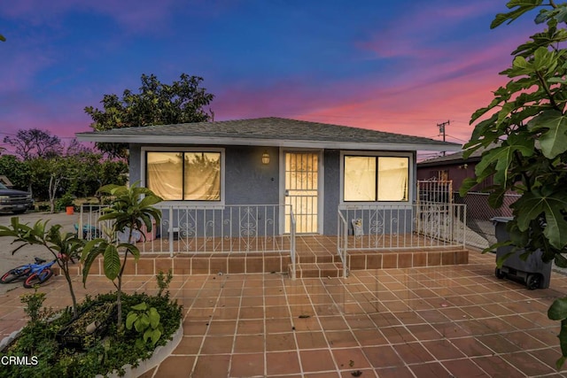 508N N Mckinley Ave, Oxnard, CA 93030 - view of front facade featuring stucco siding, covered porch, and a shingled roof