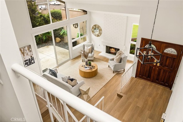 19795 Futura Dr, Yorba Linda, CA 92886 - living area with wood finished floors, a fireplace, and high vaulted ceiling