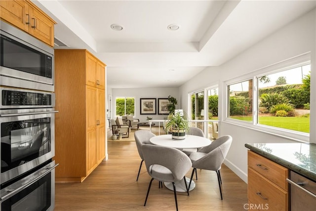19795 Futura Dr, Yorba Linda, CA 92886 - dining space featuring wood finished floors, a raised ceiling, and recessed lighting