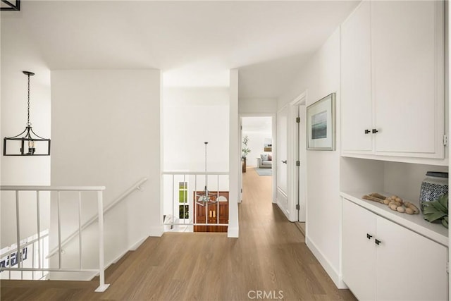 19795 Futura Dr, Yorba Linda, CA 92886 - corridor with an upstairs landing, wood finished floors, and a chandelier