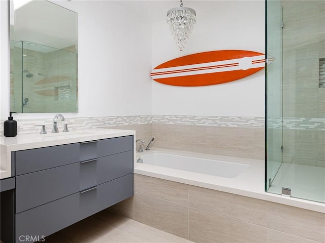 22477 Kent, Torrance, CA 90505 - full bath with a stall shower, vanity, a garden tub, and a chandelier