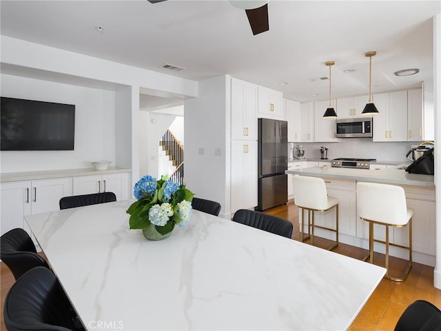22477 Kent, Torrance, CA 90505 - dining room featuring light wood finished floors and ceiling fan