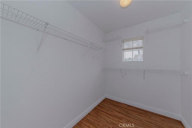 24646 Maple Ln, Harbor City, CA 90710 - walk in closet featuring wood finished floors