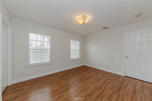 24646 Maple Ln, Harbor City, CA 90710 - empty room with wood finished floors and a smoke detector