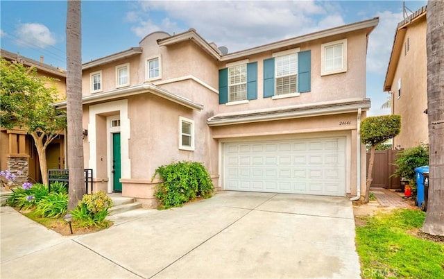 24646 Maple Ln, Harbor City, CA 90710 - view of front of home with a garage, driveway, and stucco siding