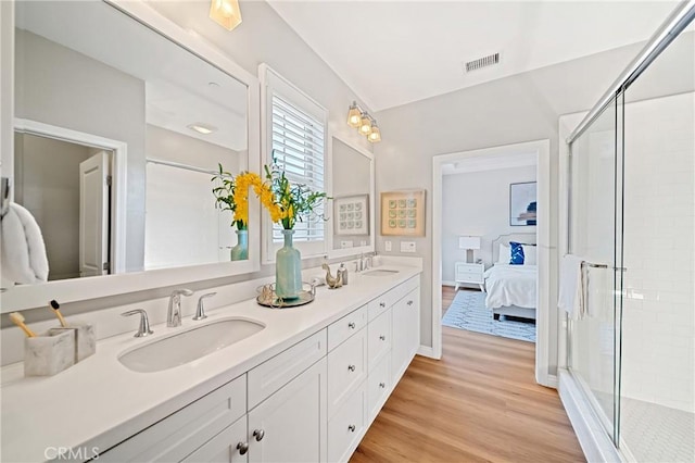 89 Overbrook, Irvine, CA 92620 - full bathroom featuring double vanity, wood finished floors, ensuite bath, and a shower stall