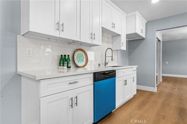 10352 Lincoln Ave, Hesperia, CA 92345 - kitchen with dishwashing machine, light wood finished floors, white cabinets, decorative backsplash, and recessed lighting