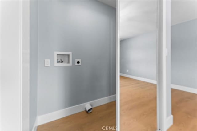 10352 Lincoln Ave, Hesperia, CA 92345 - washroom with washer hookup, electric dryer hookup, and wood finished floors