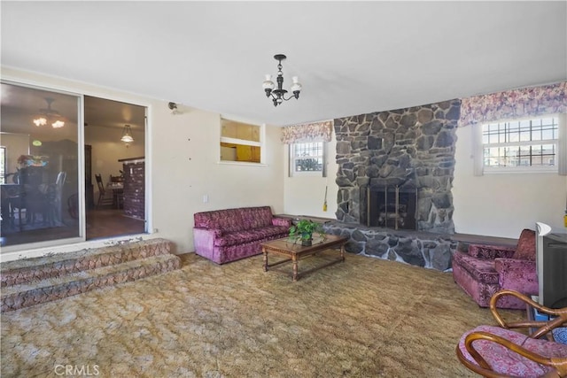 8707 Chester St, Paramount, CA 90723 - carpeted living area featuring a stone fireplace and a chandelier