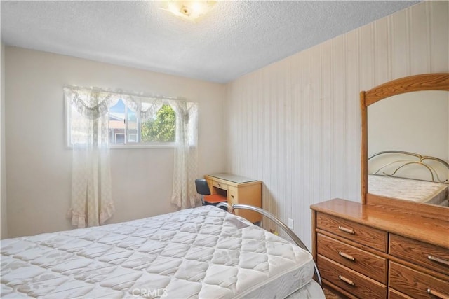 8707 Chester St, Paramount, CA 90723 - bedroom featuring a textured ceiling and wallpapered walls
