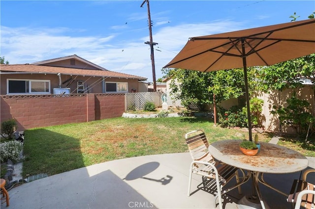 8707 Chester St, Paramount, CA 90723 - fenced backyard with a patio and outdoor dining space