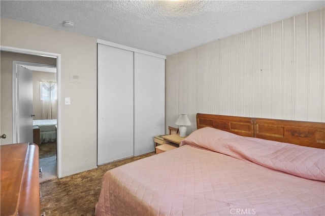 8707 Chester St, Paramount, CA 90723 - carpeted bedroom with a textured ceiling and a closet