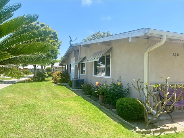 1871 Golden Rain Rd Unit M14-26H, Seal Beach, CA 90740 - view of property exterior with stucco siding and a lawn