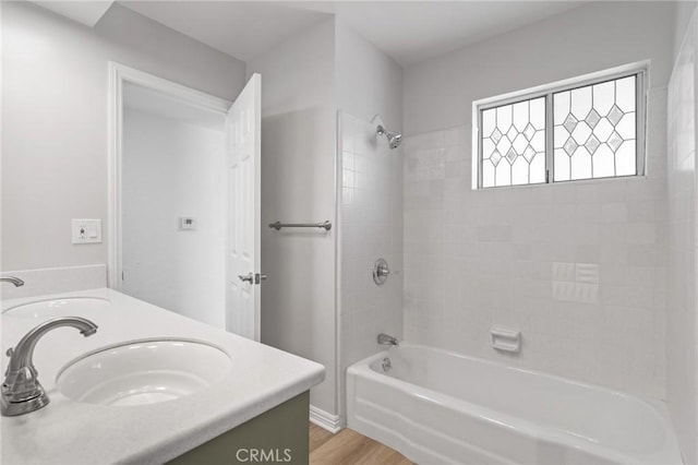 6210 Riverside Ave, Rialto, CA 92377 - bathroom with double vanity, bathing tub / shower combination, and wood finished floors