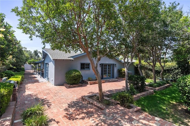 6210 Riverside Ave, Rialto, CA 92377 - back of property with stucco siding, french doors, and a patio