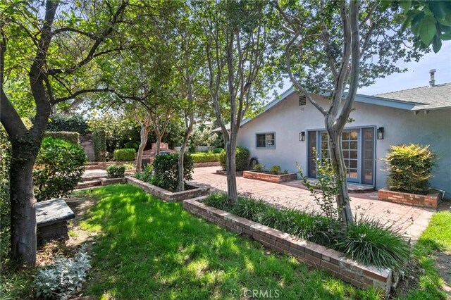 6210 Riverside Ave, Rialto, CA 92377 - view of grassy yard with a patio
