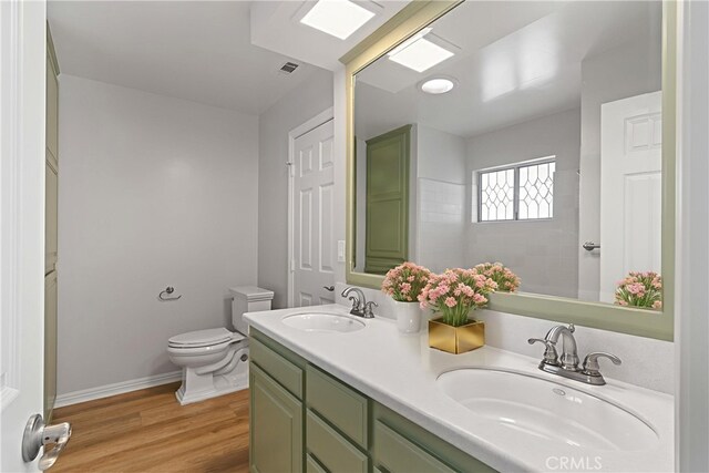 6210 Riverside Ave, Rialto, CA 92377 - full bath with double vanity and wood finished floors
