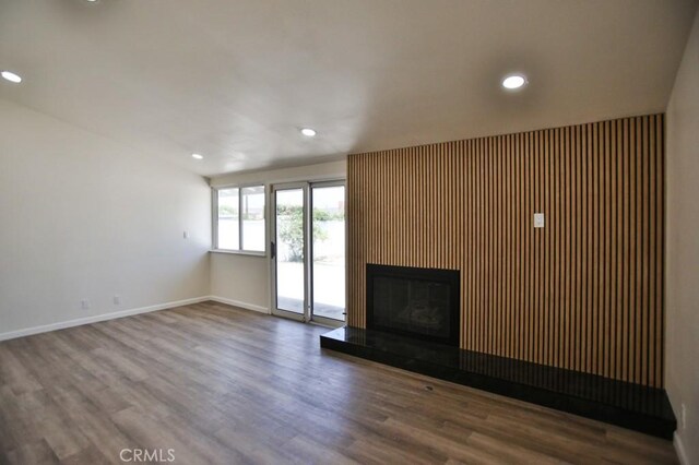 13282 Cherry St, Westminster, CA 92683 - unfurnished living room featuring wood finished floors, a glass covered fireplace, and recessed lighting