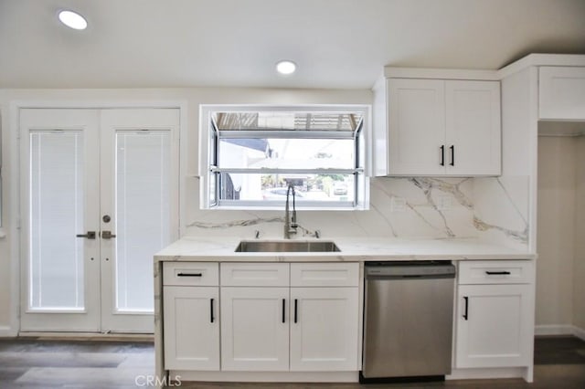 13282 Cherry St, Westminster, CA 92683 - kitchen with stainless steel dishwasher, white cabinets, light stone countertops, backsplash, and dark wood finished floors
