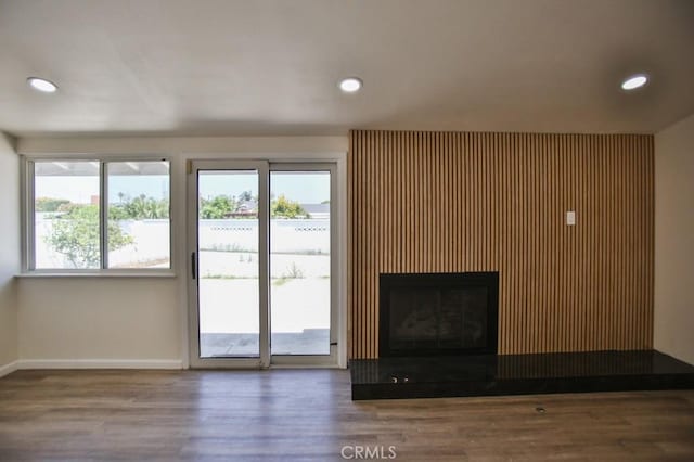 13282 Cherry St, Westminster, CA 92683 - unfurnished living room featuring wood finished floors, recessed lighting, and a glass covered fireplace