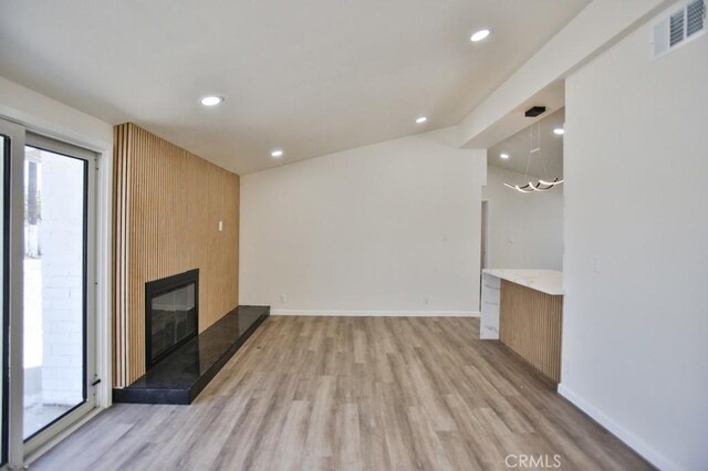 13282 Cherry St, Westminster, CA 92683 - unfurnished living room featuring light wood-style flooring, recessed lighting, and a large fireplace