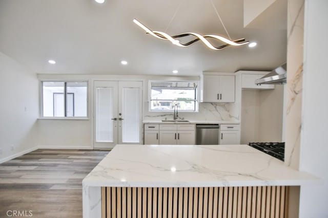 13282 Cherry St, Westminster, CA 92683 - kitchen featuring ventilation hood, dishwasher, light stone counters, light wood-type flooring, and white cabinetry