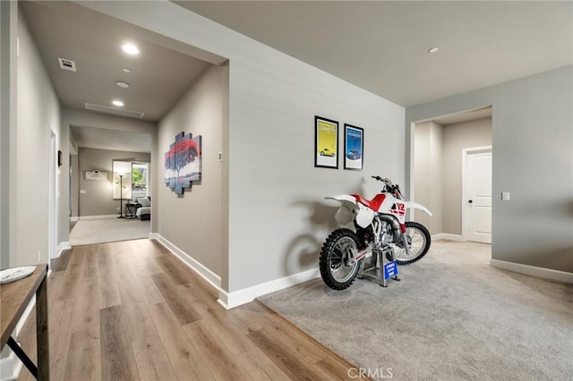 24420 Crooked Trail Dr, Menifee, CA 92584 - hallway with wood finished floors and recessed lighting