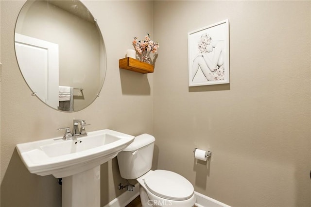 24420 Crooked Trail Dr, Menifee, CA 92584 - half bathroom featuring toilet and baseboards