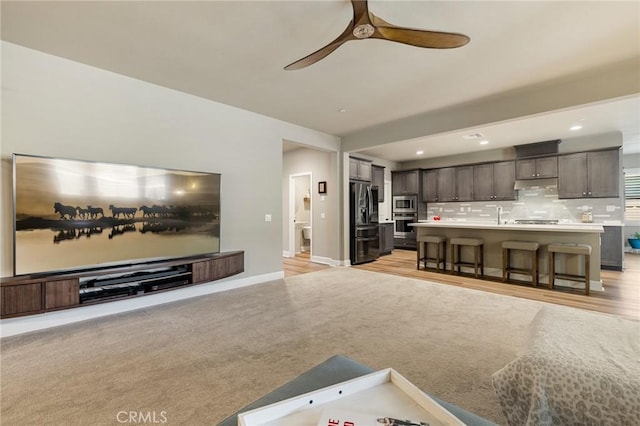 24420 Crooked Trail Dr, Menifee, CA 92584 - living area featuring ceiling fan, recessed lighting, and light wood finished floors
