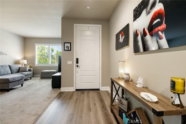 24420 Crooked Trail Dr, Menifee, CA 92584 - foyer featuring wood finished floors and baseboards