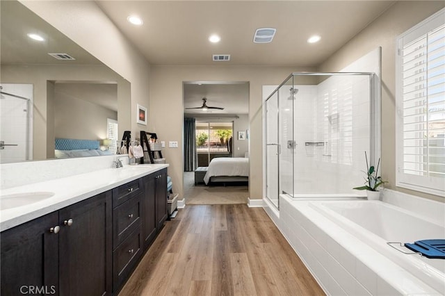24420 Crooked Trail Dr, Menifee, CA 92584 - full bath featuring ensuite bathroom, wood finished floors, a shower stall, a bath, and recessed lighting