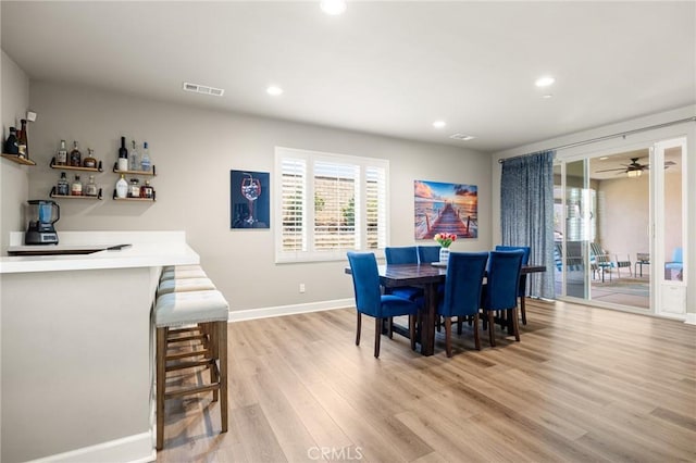 24420 Crooked Trail Dr, Menifee, CA 92584 - dining room with light wood-style floors, recessed lighting, a dry bar, and a ceiling fan
