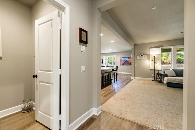 24420 Crooked Trail Dr, Menifee, CA 92584 - corridor with wood finished floors and recessed lighting