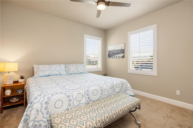 24420 Crooked Trail Dr, Menifee, CA 92584 - bedroom with carpet floors, multiple windows, and ceiling fan