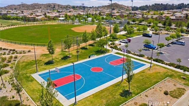 24420 Crooked Trail Dr, Menifee, CA 92584 - view of basketball court featuring a residential view and community basketball court
