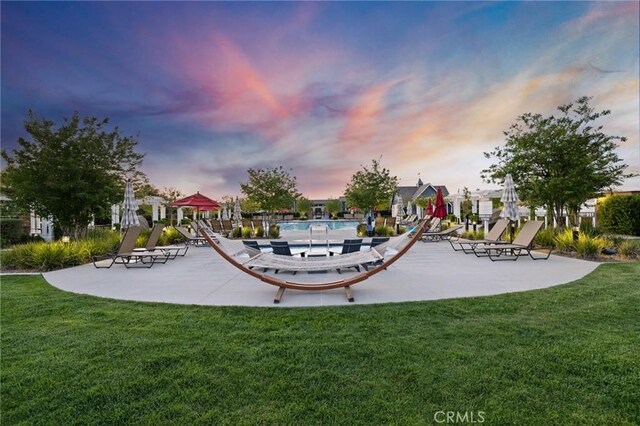 24420 Crooked Trail Dr, Menifee, CA 92584 - view of community with a yard, a pool, and a patio