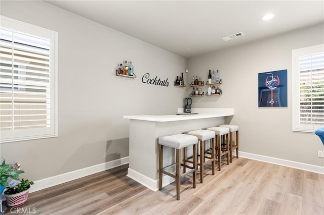 24420 Crooked Trail Dr, Menifee, CA 92584 - indoor dry bar with light wood-type flooring and recessed lighting