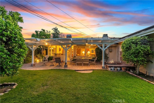 9214 Mclennan Ave, Northridge, CA 91343 - rear view of house featuring a pergola, a lawn, and a patio