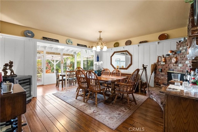 9214 Mclennan Ave, Northridge, CA 91343 - dining space with a chandelier, hardwood / wood-style flooring, and wine cooler