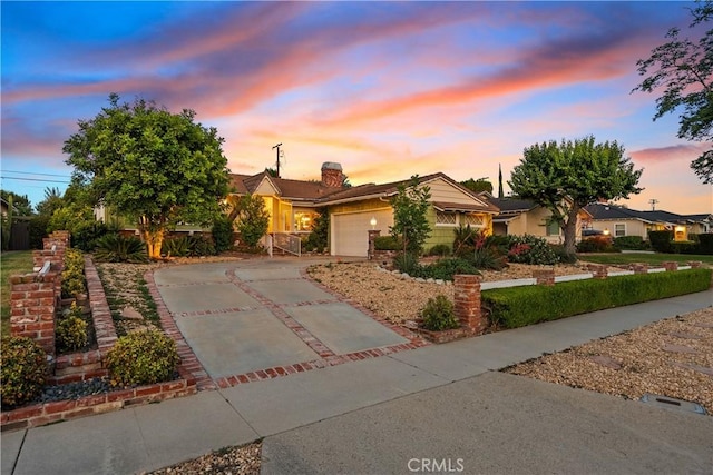9214 Mclennan Ave, Northridge, CA 91343 - view of front facade featuring driveway and an attached garage