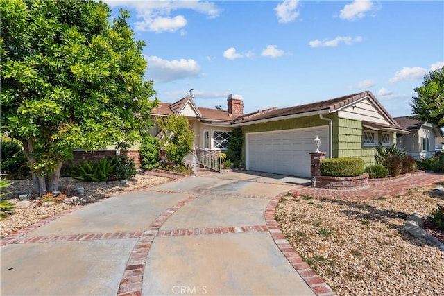 9214 Mclennan Ave, Northridge, CA 91343 - view of front facade featuring driveway and an attached garage