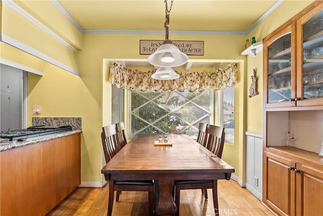 9214 Mclennan Ave, Northridge, CA 91343 - dining area featuring light wood-style floors and ornamental molding