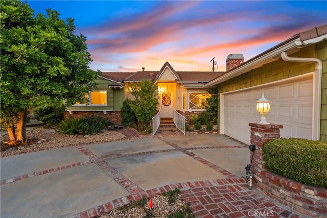 9214 Mclennan Ave, Northridge, CA 91343 - single story home featuring driveway, a chimney, and an attached garage
